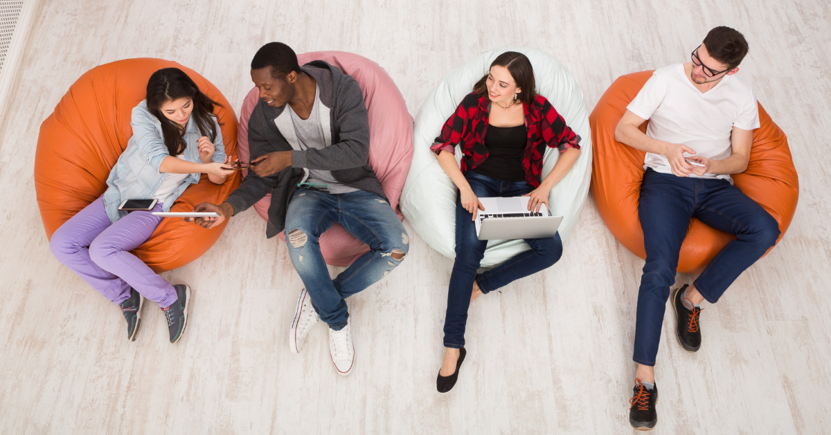 Teenagers connected to smart devices, such as laptops